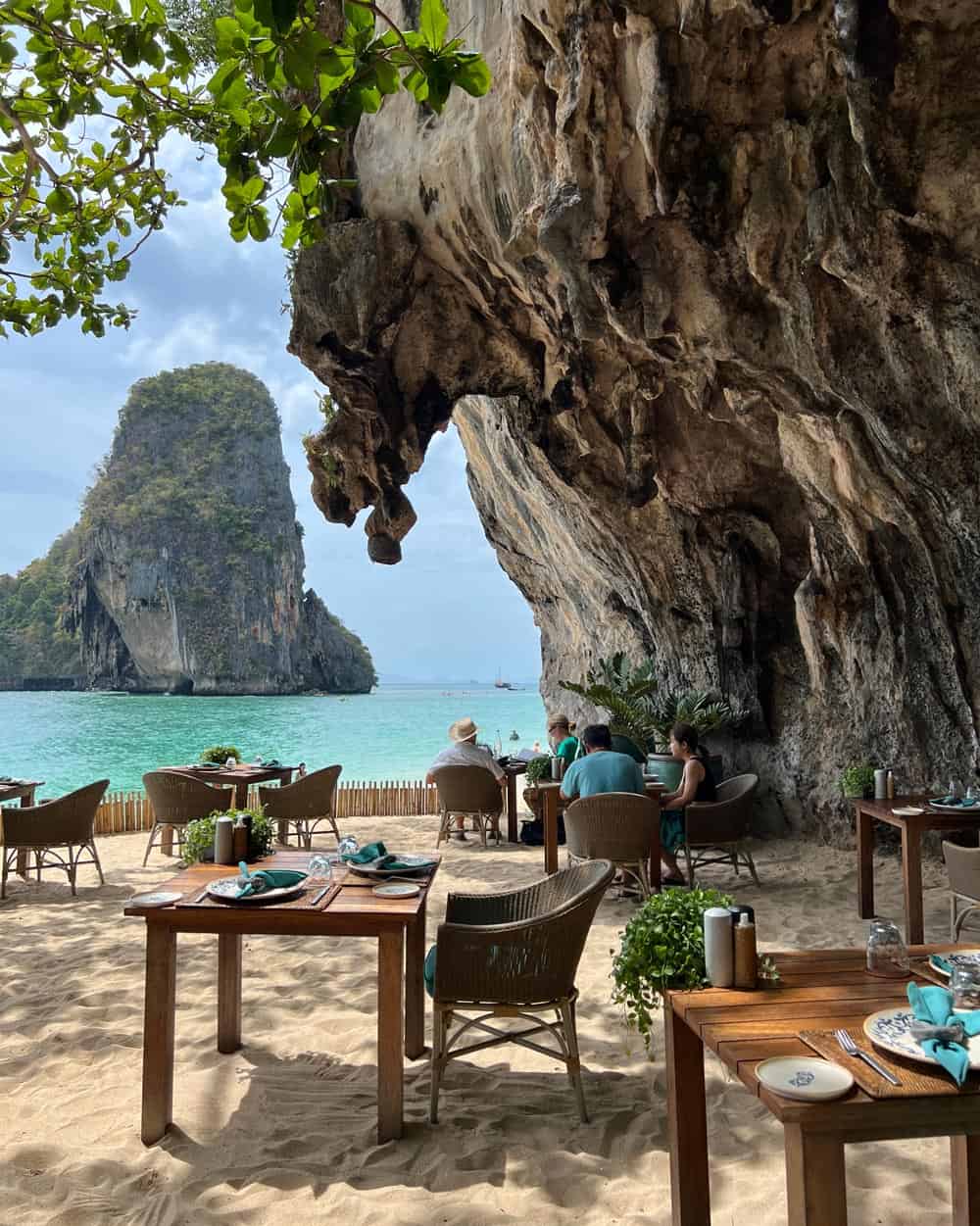 Tables in the Sand overlooking karsts at The Grotto restaurant, Rayavadee