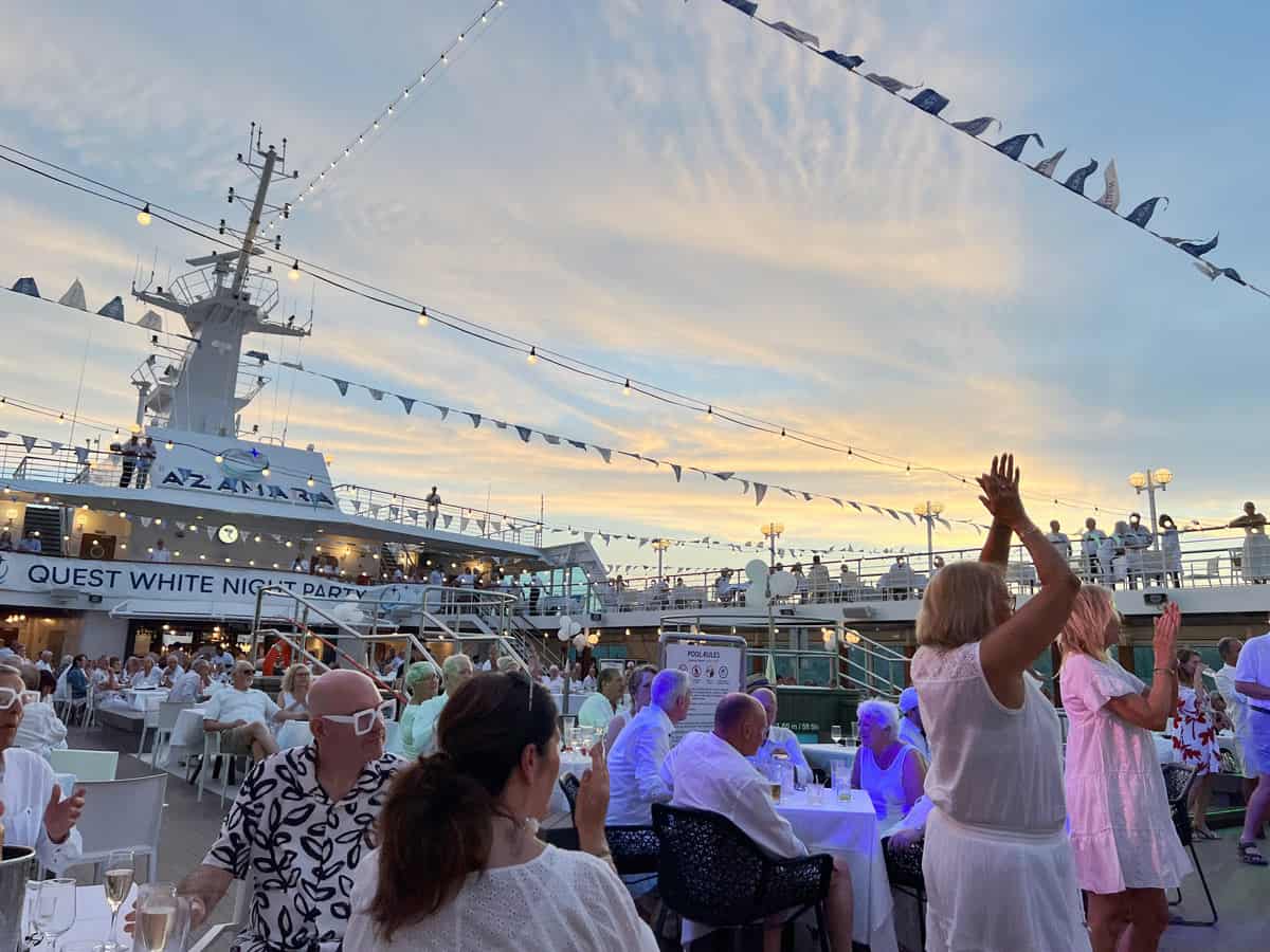 Passengers feast and dance at the White Night Party on Azamara Quest.