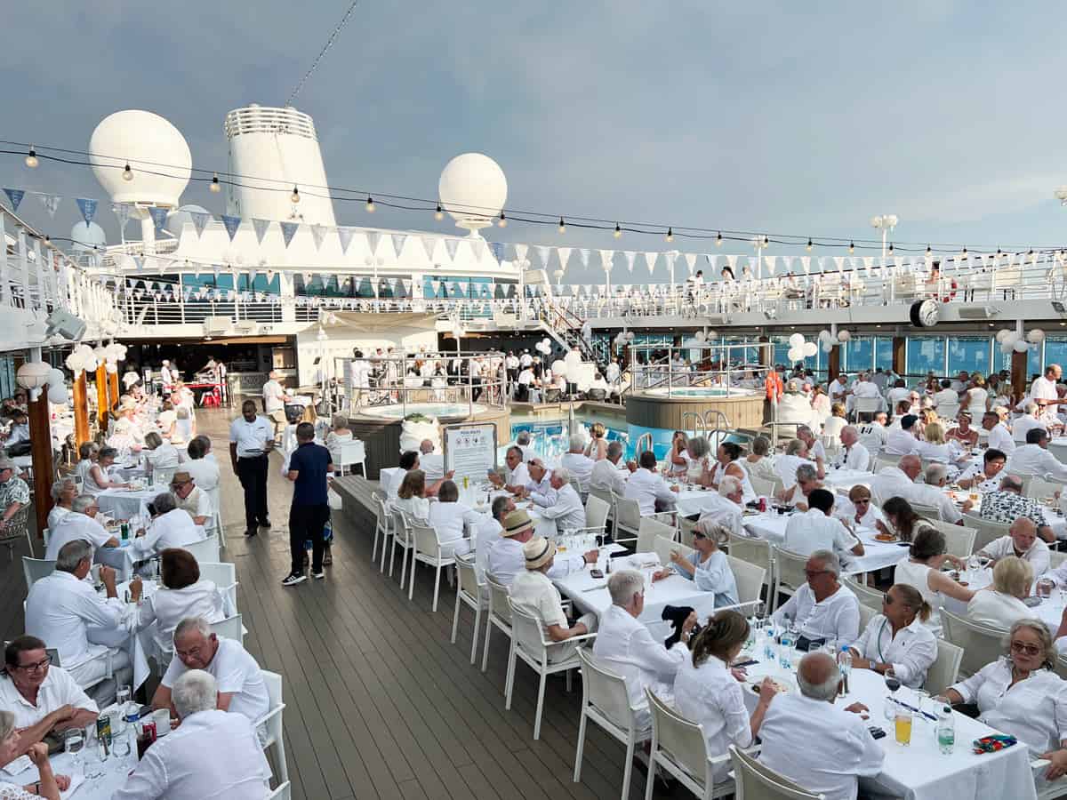 A sea of white-dressed passengers at Azamara's famous White Night Party on the Quest's pool deck