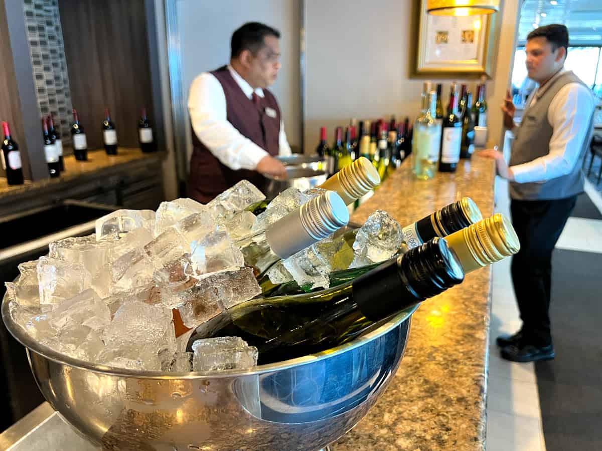 Bottles of wine in a big silver bowl of ice