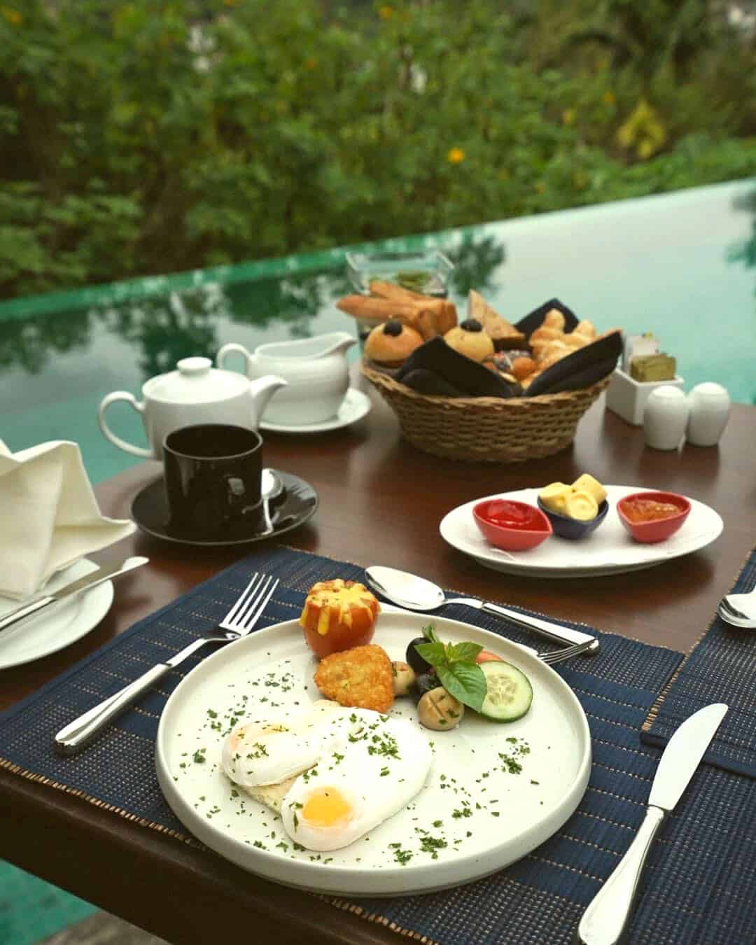 Two fried eggs with breakfast served beside the infinity pool at Kings Pavilion Luxury Hotel in Kandy